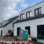 Straßenansicht des Neubaus von drei Mehrfamilienhäusern in Münster (NRW)